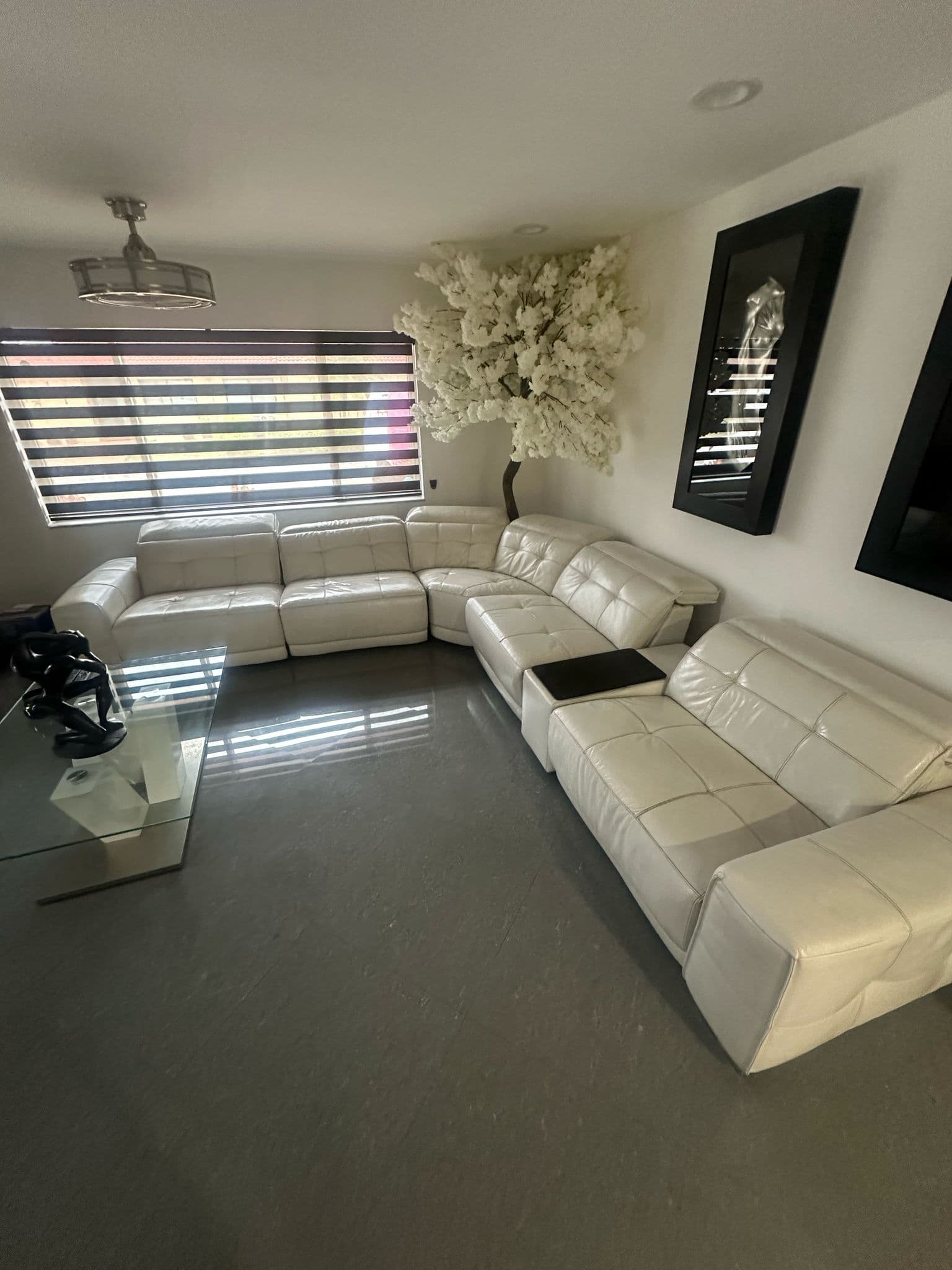Real white leather sectional sofa in a Miami home